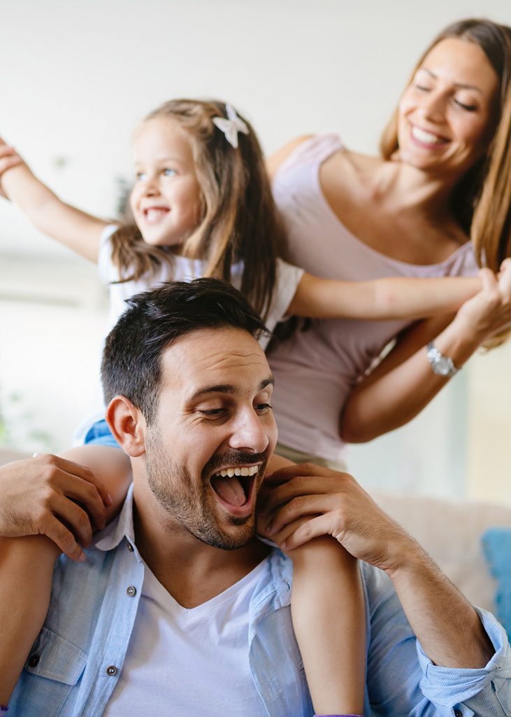 Happy family having fun times at home together