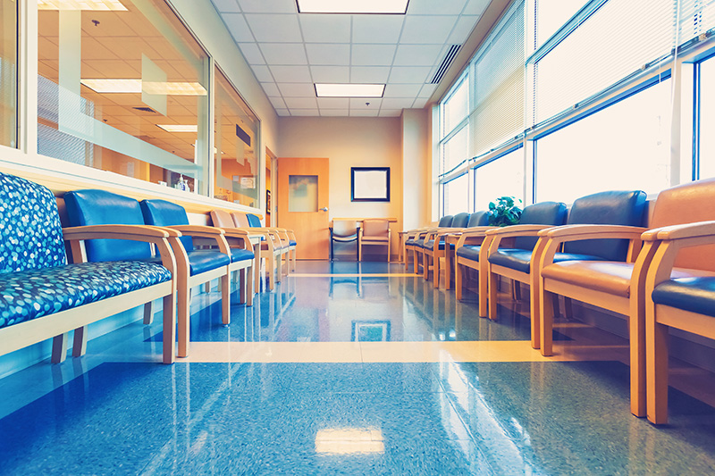 Empty blue interior waiting room at medical office